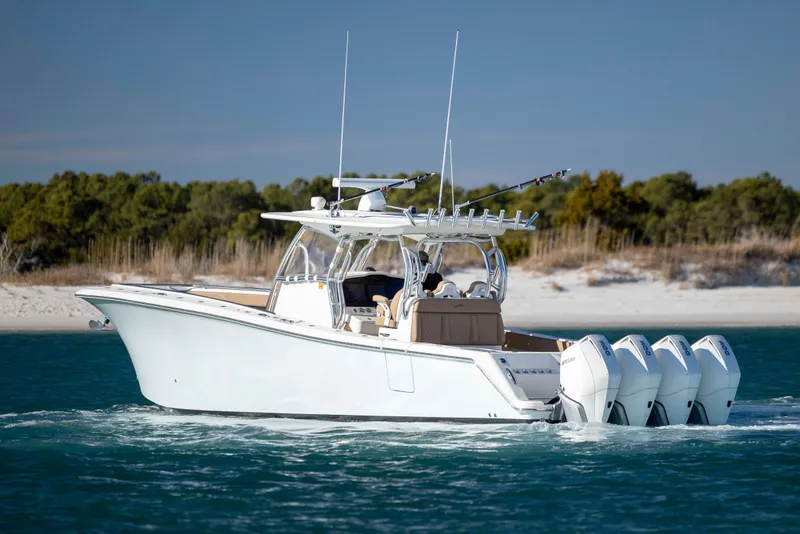Slide: The Image of 2020 Blackwater 41 Tournament boat cruising near sandy shoreline. - 5