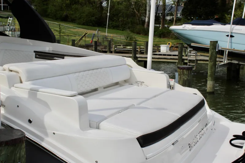 Slide: The Image of 2018 Sea Ray SDX 290 Outboard at dock, luxurious white upholstery. - 14