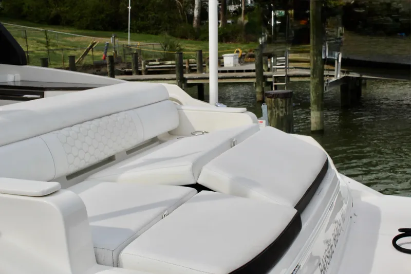 Slide: The Image of 2018 Sea Ray SDX 290 Outboard with luxurious white seating area at the dock. - 16