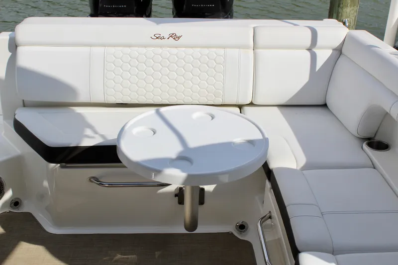 Slide: The Image of Interior of 2018 Sea Ray SDX 290 Outboard with white seating area. - 38