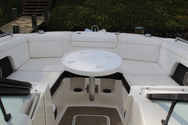 Slide: The Image of Interior of 2018 Sea Ray SDX 290 Outboard with white seating area. - 40
