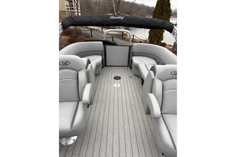 Slide: The Image of 2026 Bentley Pontoons Legacy 223 Navigator interior with gray seating and sleek design. - 5