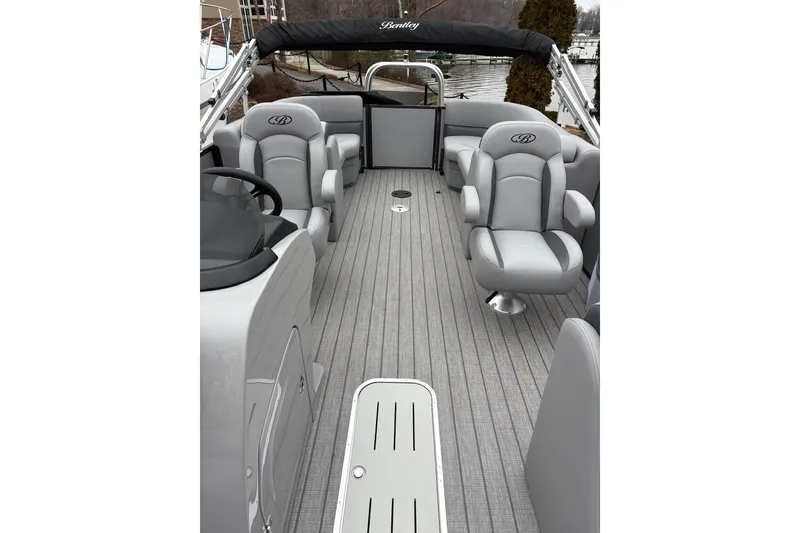 Slide: The Image of 2026 Bentley Pontoons Legacy 223 Navigator interior with gray seating and sleek design. - 6
