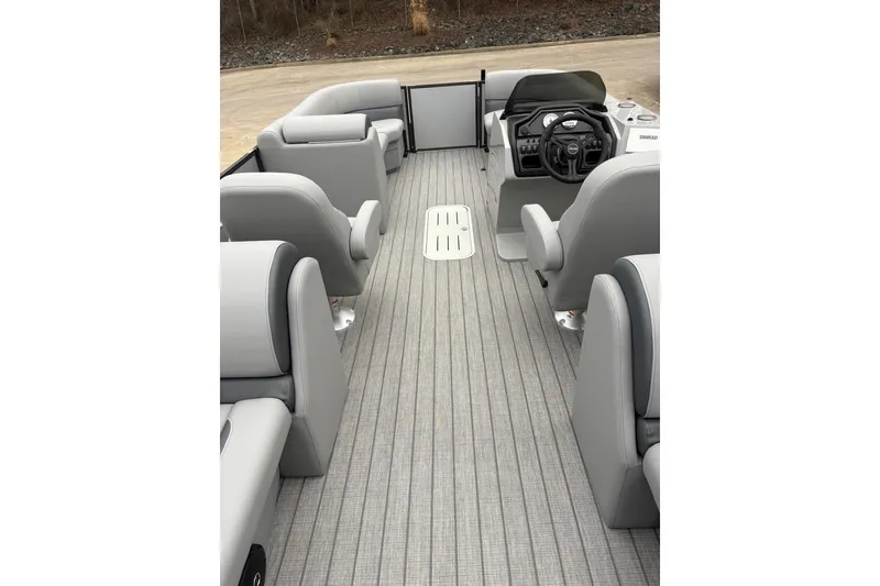 Slide: The Image of 2026 Bentley Pontoons Legacy 223 Navigator interior with sleek seating and modern helm. - 7