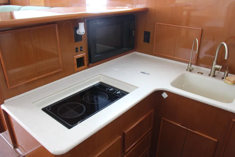 Slide: The Image of Modern yacht kitchen with stove, sink, and microwave, Post 50 model, year 2000. - 11