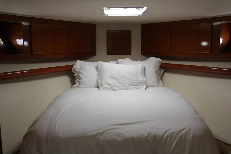 Slide: The Image of Cozy cabin bedroom with white bedding in a 2000 Post 50 model yacht. - 13