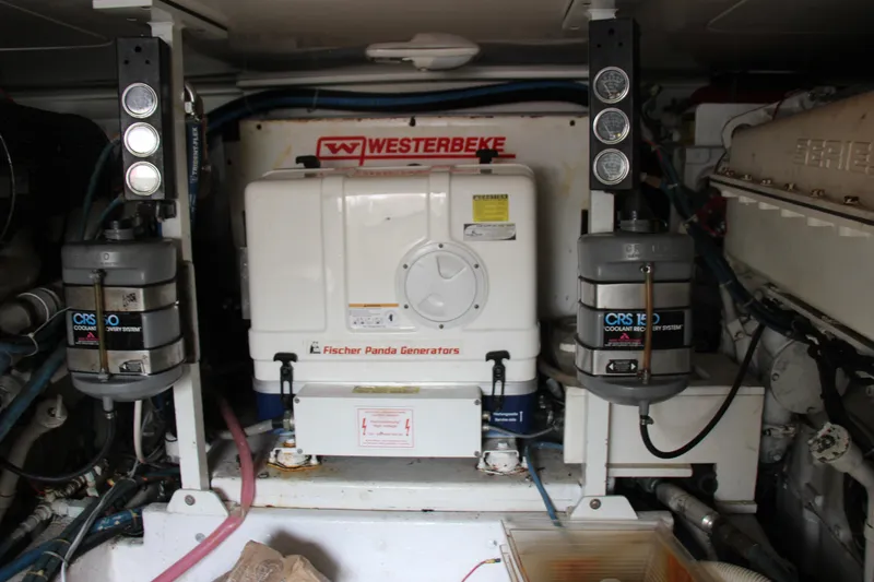 Slide: The Image of Engine room with Fischer Panda generator and coolant recovery systems, Post 50, year 2000. - 22