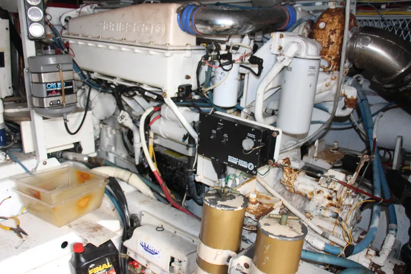Slide: The Image of Engine room of a 2000 Post 50 yacht, showcasing complex machinery and components. - 25