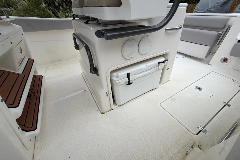Slide: The Image of 2015 Sea Fox 286 Commander boat interior with seating and storage compartments. - 20
