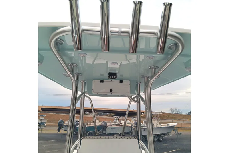 Slide: The Image of 2026 BlackJack 256 Coastal boat T-top with rod holders and sleek design. - 12