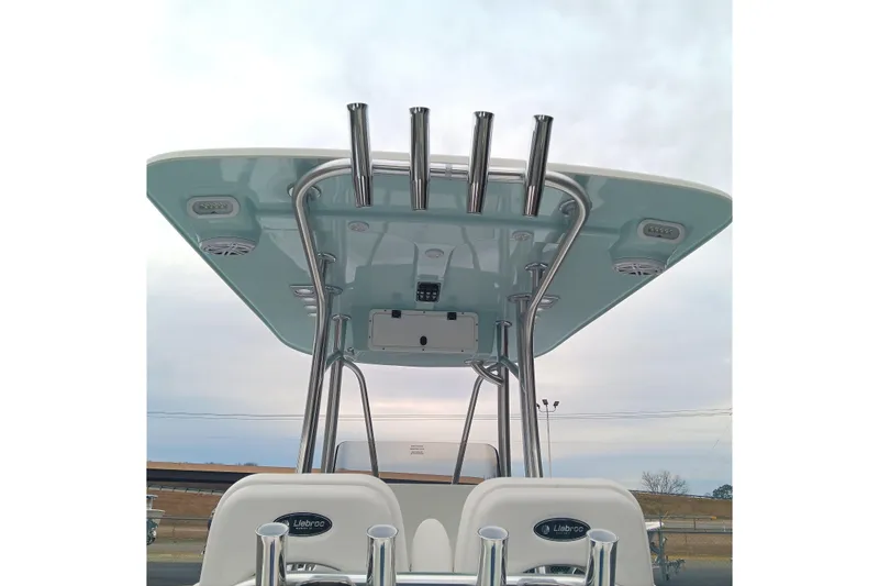 Slide: The Image of 2026 BlackJack 256 Coastal boat T-top with rod holders and speakers. - 13