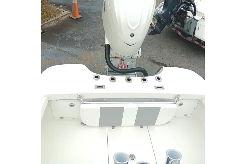 Slide: The Image of 2026 BlackJack 256 Coastal boat with outboard motor and seating area. - 14