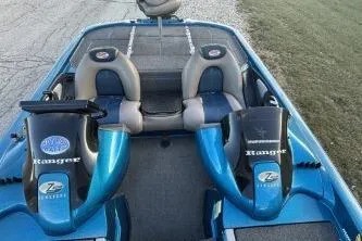 Slide: The Image of 2006 Ranger Z20 boat interior with dual seats and blue accents. - 6