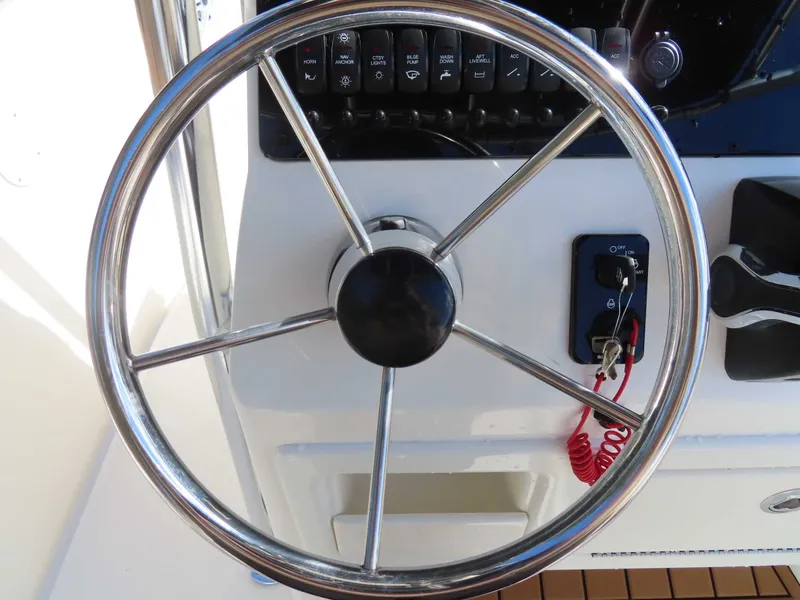 Slide: The Image of Steering wheel of a 2025 Bulls Bay 230 CC boat. - 23