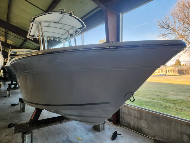 Slide: The Image of 2023 Sea Fox 248 Commander boat displayed indoors. - 4