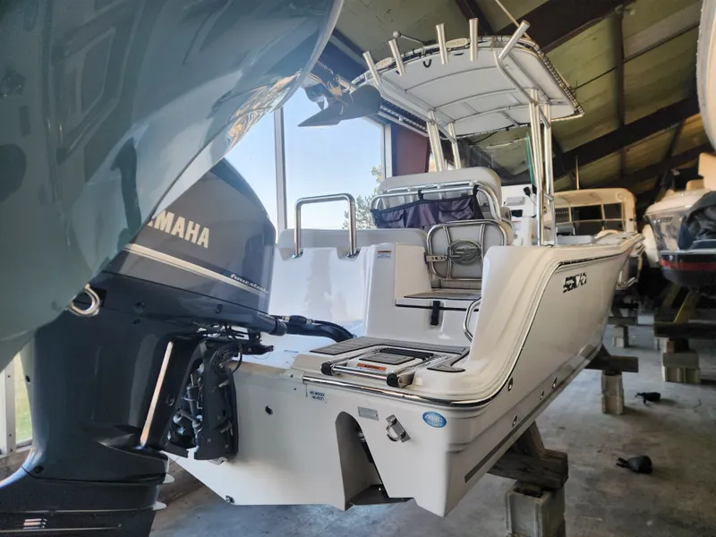 Slide: The Image of 2023 Sea Fox 248 Commander with Yamaha engine in storage facility. - 9