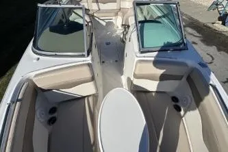 Slide: The Image of 2011 Chaparral 246 SSi boat interior with helm controls and cabin entry. - 6
