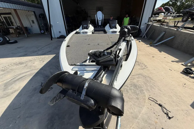 Slide: The Image of 2020 Vexus AVX 2080 boat in a garage, featuring advanced fishing equipment. - 14