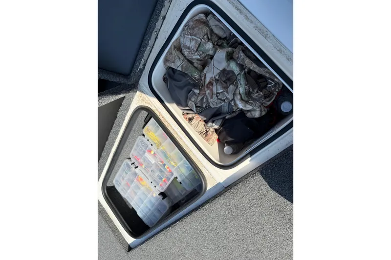 Slide: The Image of Storage compartments in a 2020 Vexus AVX 2080 boat with fishing gear and clothing. - 30
