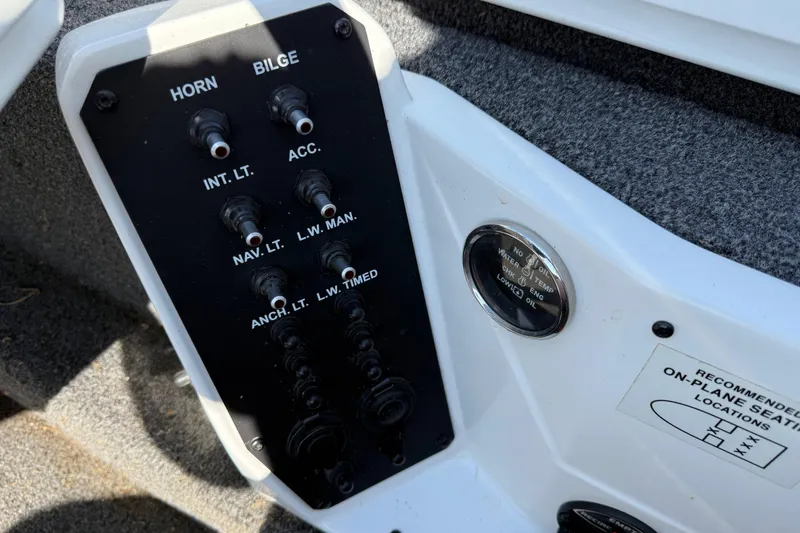 Slide: The Image of Control panel of a 2020 Vexus AVX 2080 boat with various switches and indicators. - 35