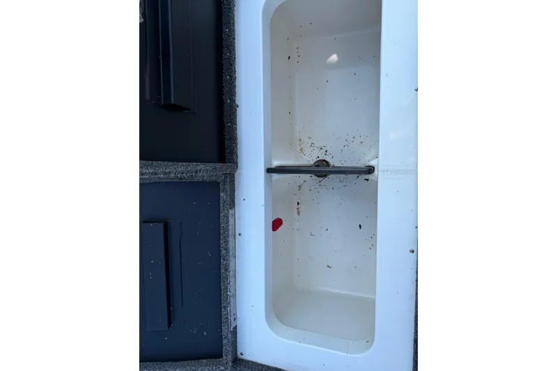Slide: The Image of 2020 Vexus AVX 2080 boat storage compartment with debris inside. - 39