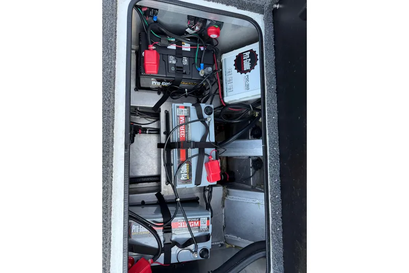 Slide: The Image of 2020 Vexus AVX 2080 boat battery compartment with wiring and power components. - 42