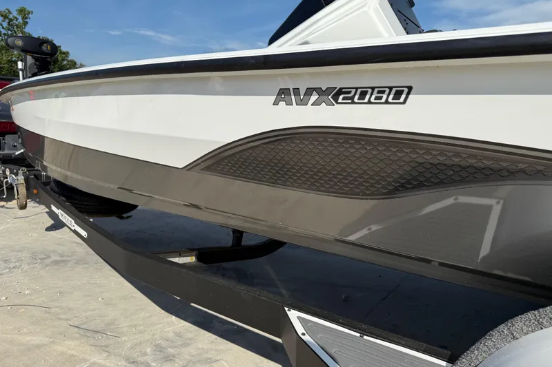 Slide: The Image of 2020 Vexus AVX 2080 boat side view with sleek design and branding. - 8
