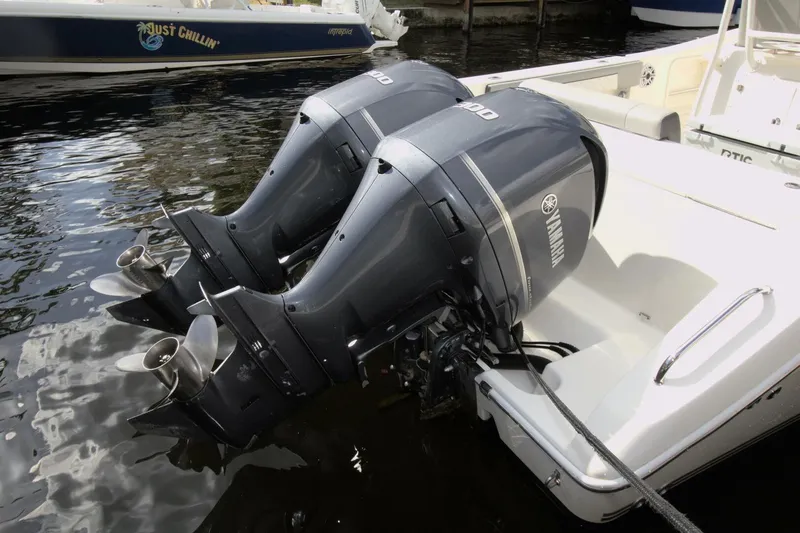 Slide: The Image of Twin Yamaha outboard motors on a 2001 Pursuit 3070 Center Console boat. - 20