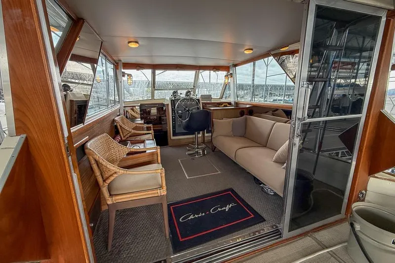 Slide: The Image of 1969 Chris-Craft 338 Commander interior with seating, steering wheel, and panoramic windows. - 25