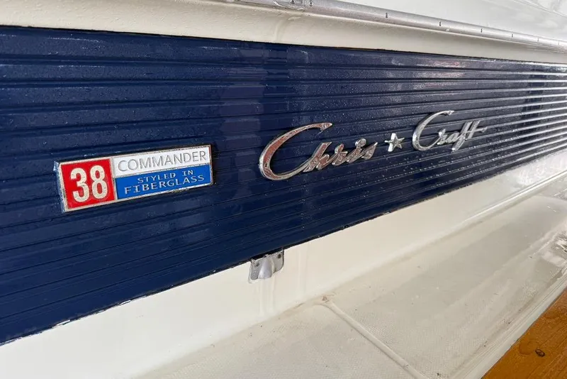 Slide: The Image of 1969 Chris-Craft 338 Commander boat emblem, styled in fiberglass, blue and white design. - 28