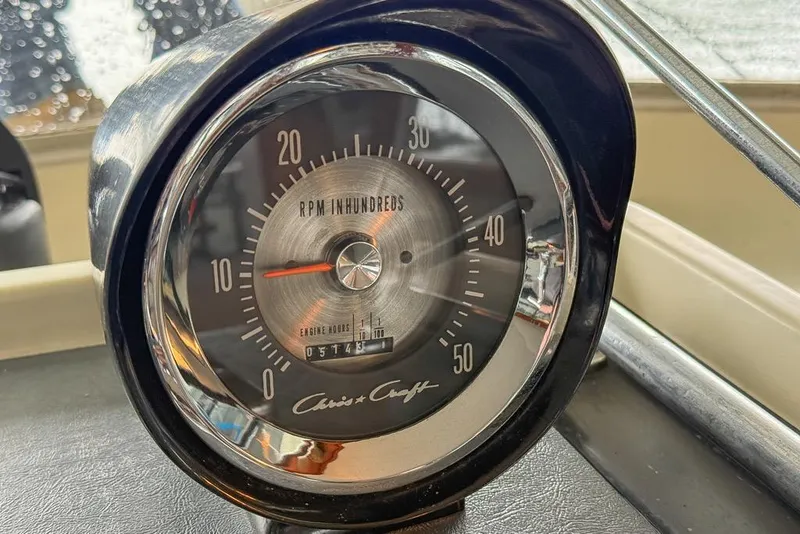 Slide: The Image of Vintage 1969 Chris-Craft 338 Commander RPM gauge, displaying engine hours and classic design. - 26
