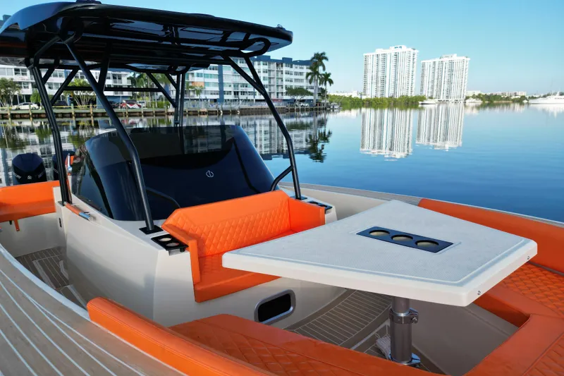 Slide: The Image of 2026 Lilybaeum Lipari 31 boat with orange seating, modern design, and waterfront view. - 17