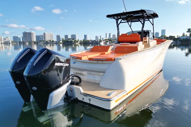 Slide: The Image of 2026 Lilybaeum Lipari 31 boat with dual Mercury engines on calm water. - 28