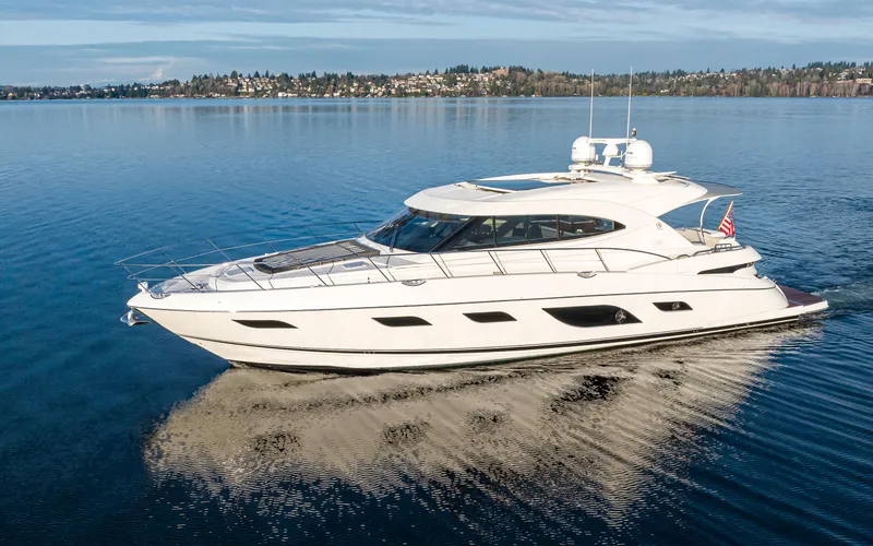 Slide: The Image of 2017 Riviera Sport Cruiser yacht on calm water, showcasing sleek design and luxury features. - 1