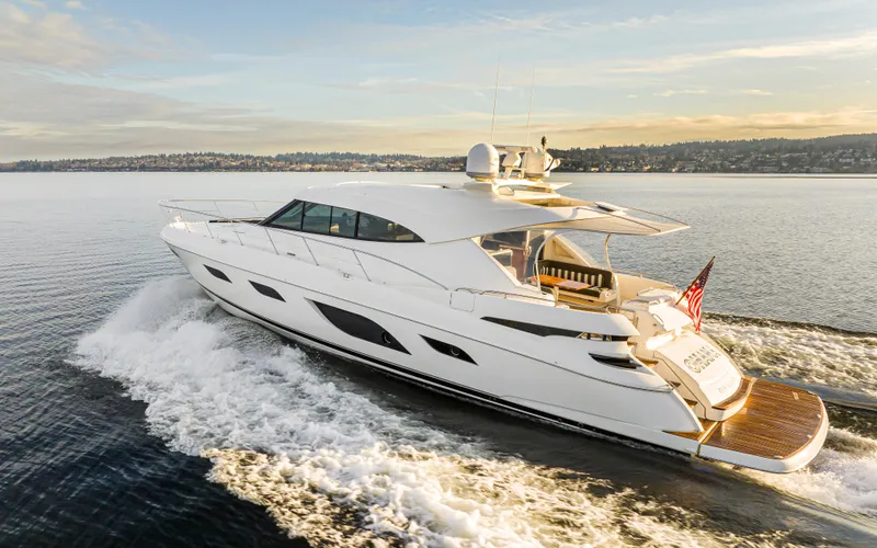Slide: The Image of 2017 Riviera Sport Cruiser yacht cruising on open water at sunset. - 11