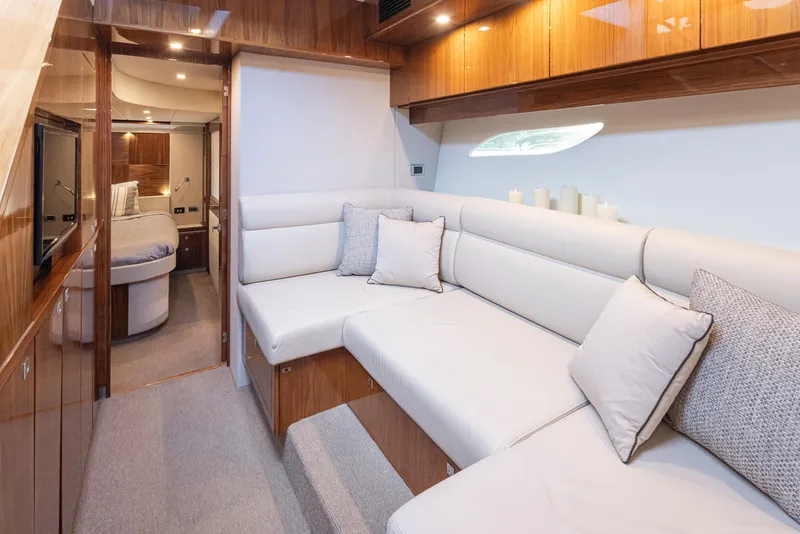 Slide: The Image of Luxurious interior of 2017 Riviera Sport Cruiser with plush seating and elegant wood finishes. - 31