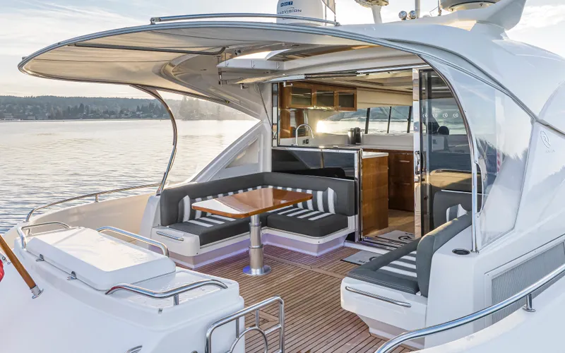Slide: The Image of 2017 Riviera Sport Cruiser yacht with elegant seating and open deck on calm waters. - 7