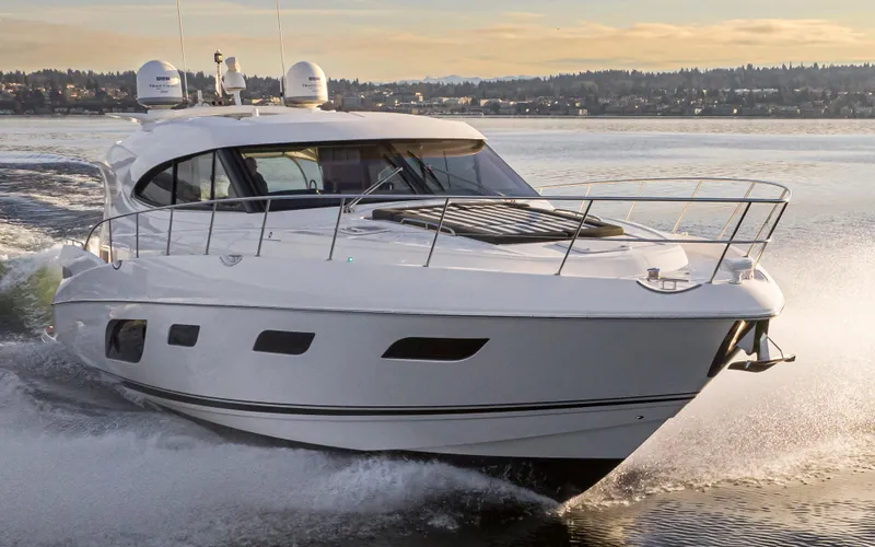 Slide: The Image of 2017 Riviera Sport Cruiser yacht navigating on calm waters. - 15