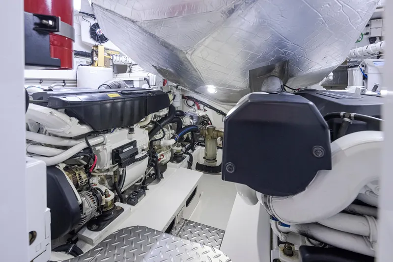 Slide: The Image of Engine room of a 2017 Riviera Sport Cruiser, showcasing mechanical components and equipment. - 16