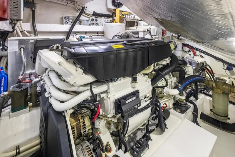 Slide: The Image of Engine room of a 2017 Riviera Sport Cruiser, showcasing detailed mechanical components. - 17