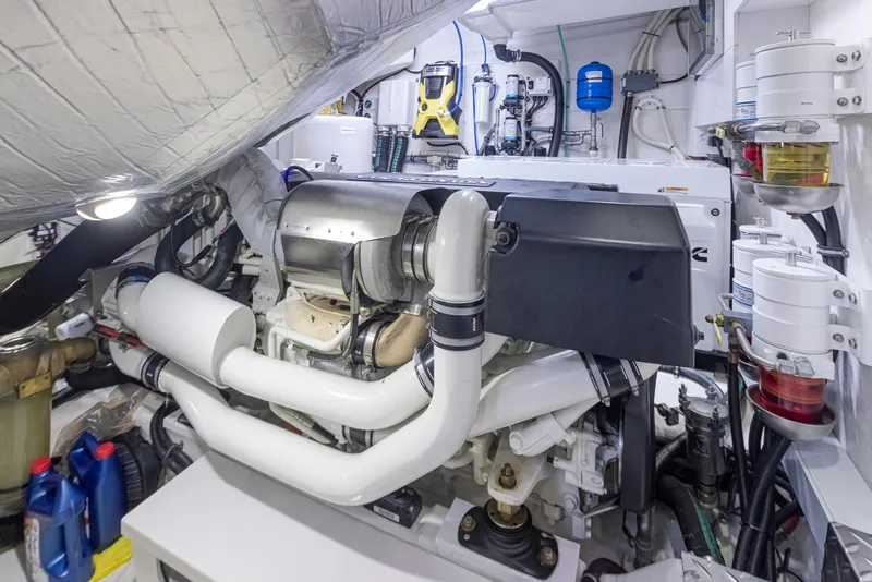 Slide: The Image of Engine room of a 2017 Riviera Sport Cruiser, showcasing complex machinery and components. - 18