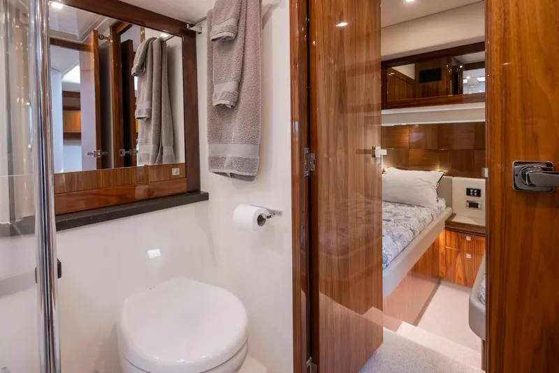 Slide: The Image of 2017 Riviera Sport Cruiser bathroom and bedroom interior with wooden finishes and modern amenities. - 35