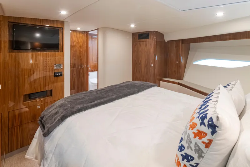 Slide: The Image of Luxurious 2017 Riviera Sport Cruiser bedroom with wood paneling and modern amenities. - 47