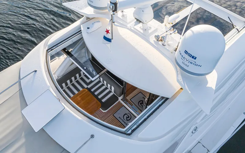 Slide: The Image of 2017 Riviera Sport Cruiser yacht with open sunroof, aerial view, modern design. - 6