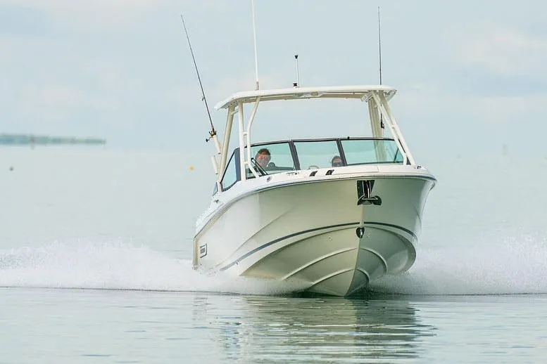 Slide: The Image of Manufacturer Provided Image: 2026 Boston Whaler 240 Vantage cruising on calm water, showcasing sleek design and performance. - 1