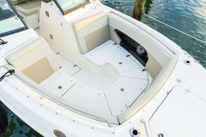 Slide: The Image of Manufacturer Provided Image: 2026 Boston Whaler 240 Vantage boat interior with spacious seating and storage. - 3