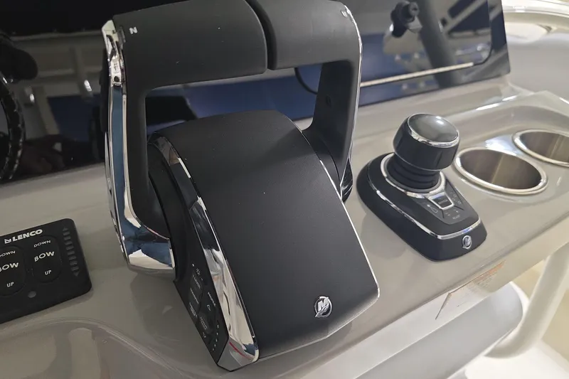 Slide: The Image of Control panel of 2026 Boston Whaler 330 Outrage boat with throttle and joystick. - 28