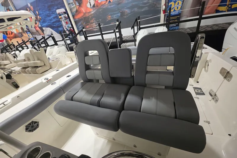 Slide: The Image of 2026 Boston Whaler 330 Outrage boat interior with sleek, modern seating design. - 29