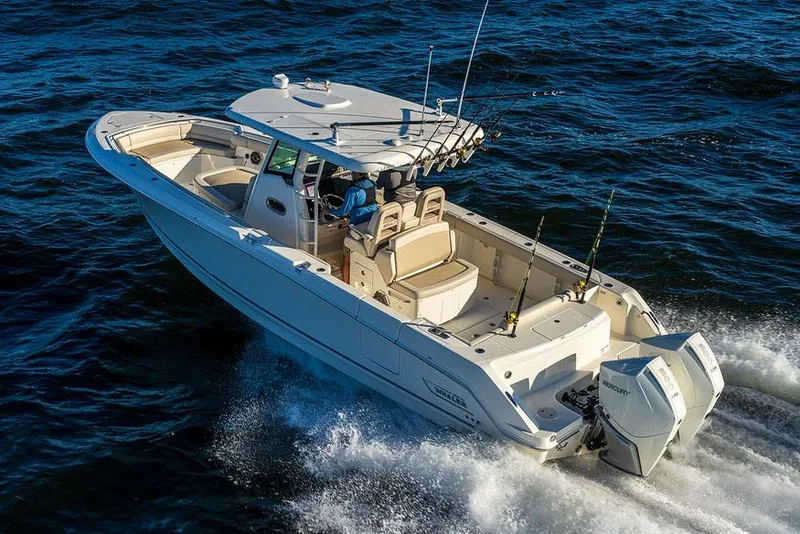 Slide: The Image of Manufacturer Provided Image: 2025 Boston Whaler 330 Outrage cruising on open water. - 3