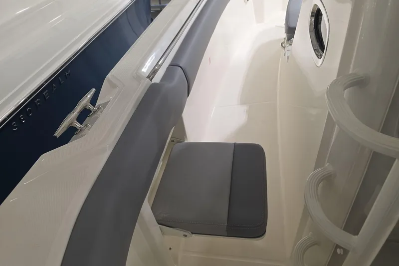 Slide: The Image of 2026 Boston Whaler 330 Outrage interior seating and deck detail. - 36